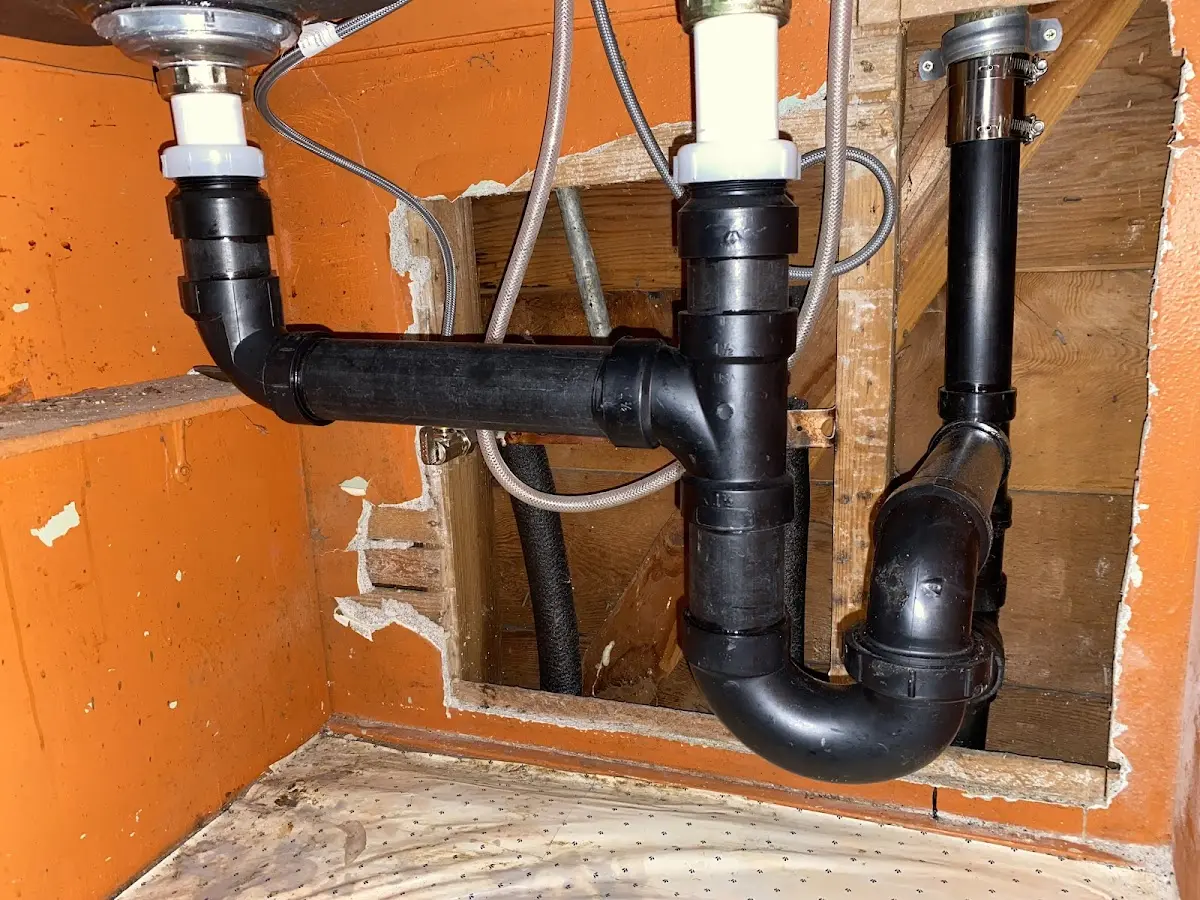 Professional Garbage Disposal Repair equipment and tools on the job in Ely